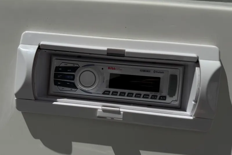 Slide: The Image of Built-in stereo system with Bluetooth, featuring Boss Audio branding, in a Warlock Ultimate 1996 model. - 24