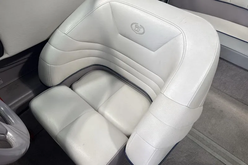 Slide: The Image of White leather seat in a 1997 Cobalt 200 boat interior. - 13