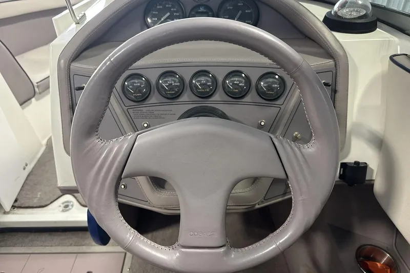 Slide: The Image of Steering wheel and dashboard of a 1997 Cobalt 200 boat. - 14
