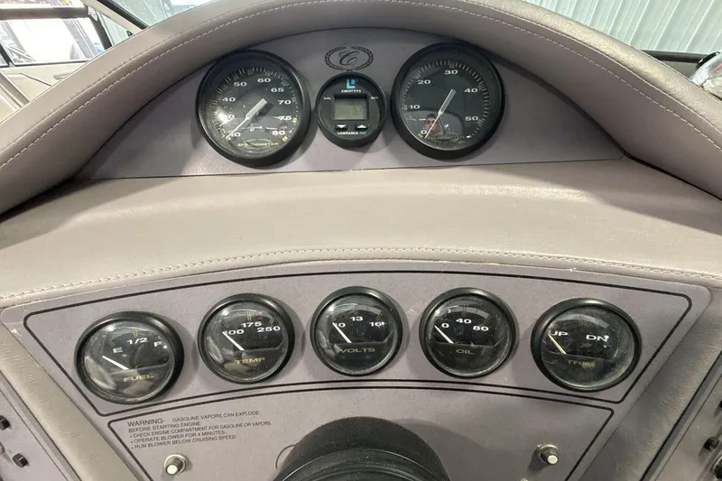 Slide: The Image of Dashboard of a 1997 Cobalt 200 boat with various gauges and controls. - 15