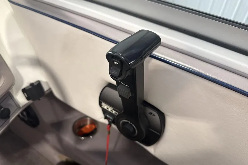 Slide: The Image of Throttle control lever in a 1997 Cobalt 200 boat interior. - 16