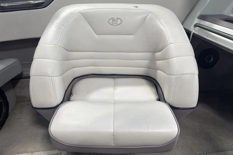 Slide: The Image of White leather seat in a 1997 Cobalt 200 boat interior. - 17