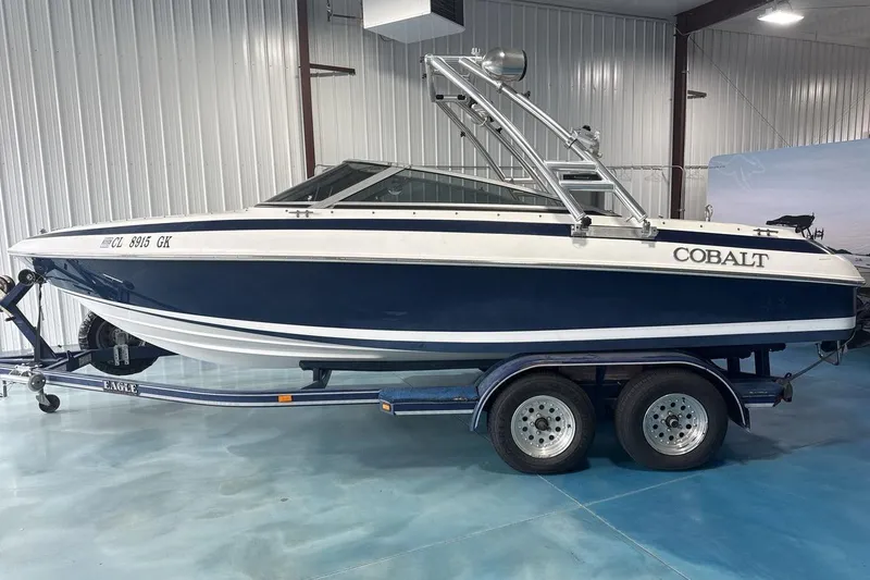 Slide: The Image of 1997 Cobalt 200 boat on trailer in indoor storage facility. - 3