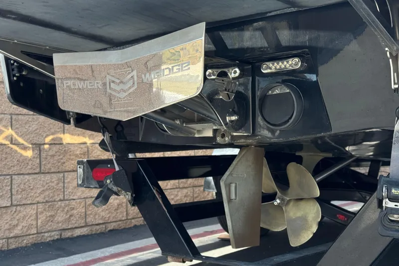 Slide: The Image of 2015 Malibu Wakesetter 247 LSV boat stern with Power Wedge and propeller. - 10