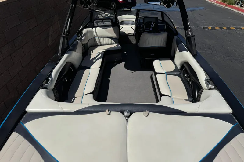 Slide: The Image of 2015 Malibu Wakesetter 247 LSV interior with spacious seating and sleek design. - 11