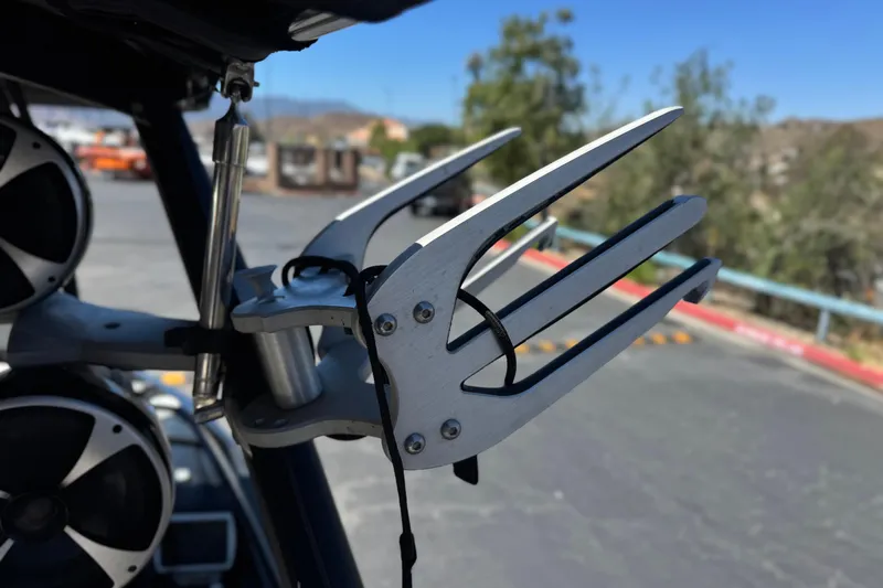 Slide: The Image of Wakeboard rack on 2015 Malibu Wakesetter 247 LSV, featuring sleek metal design. - 19