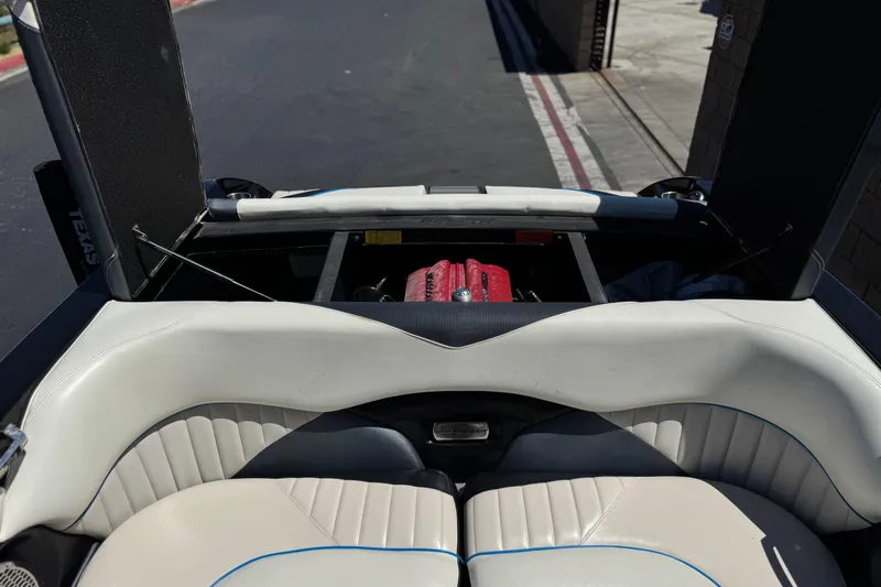 Slide: The Image of 2015 Malibu Wakesetter 247 LSV interior with open engine compartment. - 23