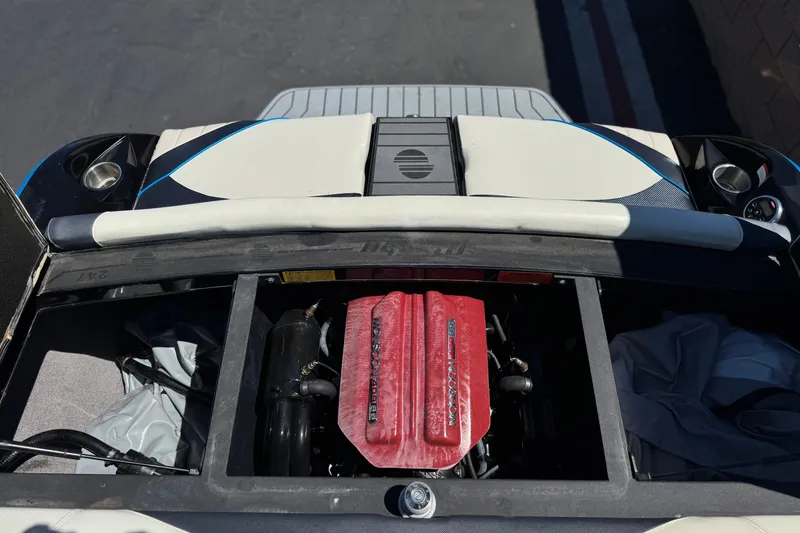 Slide: The Image of 2015 Malibu Wakesetter 247 LSV engine compartment with red cover, viewed from above. - 24
