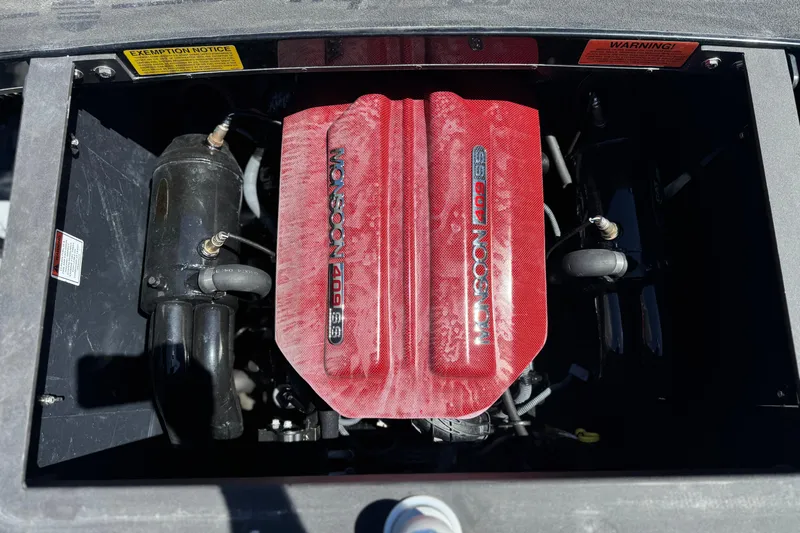 Slide: The Image of 2015 Malibu Wakesetter 247 LSV engine, featuring a red Monsoon 409 cover. - 25