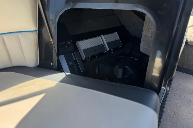 Slide: The Image of Storage compartment in a 2015 Malibu Wakesetter 247 LSV boat interior. - 27