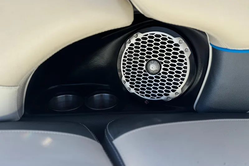 Slide: The Image of Speaker and cup holders in 2015 Malibu Wakesetter 247 LSV boat interior. - 29