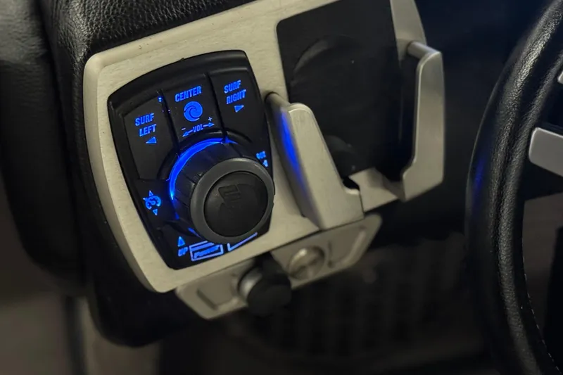 Slide: The Image of Control panel of 2015 Malibu Wakesetter 247 LSV with illuminated surf settings. - 42