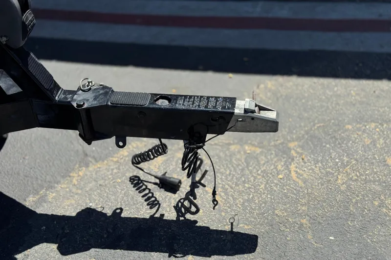 Slide: The Image of Trailer hitch of a 2015 Malibu Wakesetter 247 LSV on asphalt surface. - 44