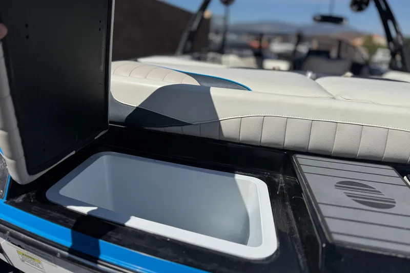 Slide: The Image of 2015 Malibu Wakesetter 247 LSV boat interior with open storage compartment. - 7