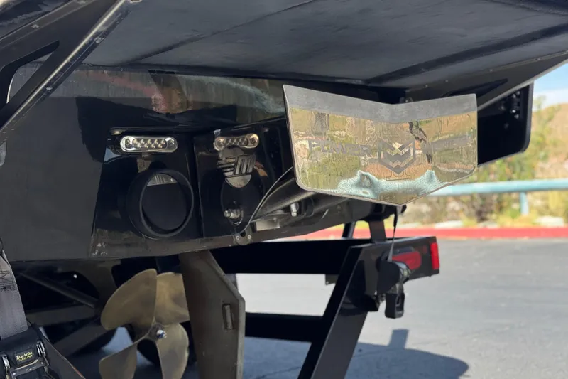 Slide: The Image of 2015 Malibu Wakesetter 247 LSV boat stern with propeller and wakeboard features. - 8