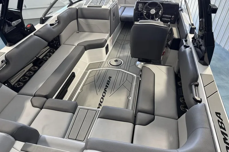Slide: The Image of 2026 Moomba Max boat interior with sleek seating and modern dashboard design. - 10