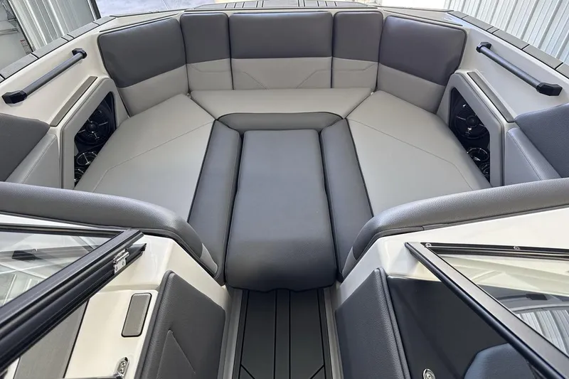 Slide: The Image of 2026 Moomba Max boat interior with gray seating and modern design. - 11