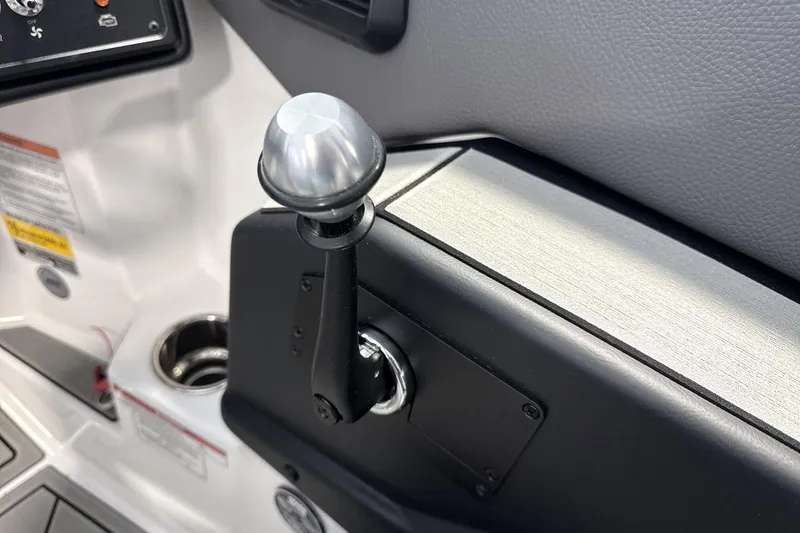 Slide: The Image of 2026 Moomba Max boat throttle control lever with sleek design and metallic finish. - 16