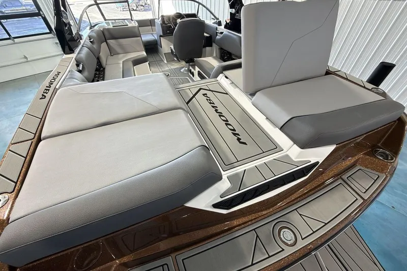 Slide: The Image of 2026 Moomba Max boat interior with spacious seating and sleek design. - 19
