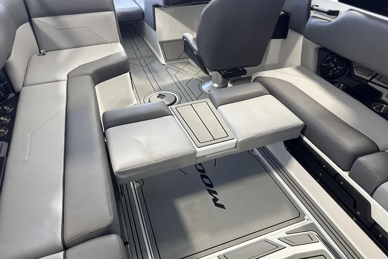 Slide: The Image of 2026 Moomba Max boat interior with gray seating and modern design. - 21