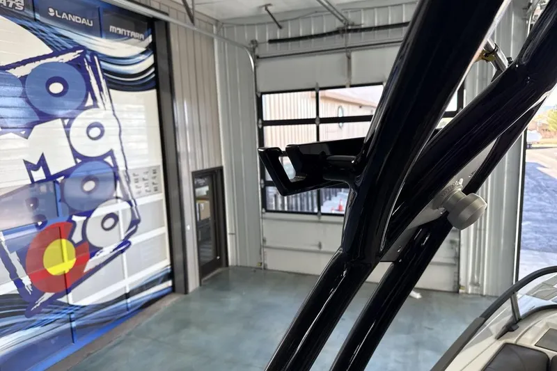 Slide: The Image of 2026 Moomba Max boat in showroom with branded wall graphics. - 22