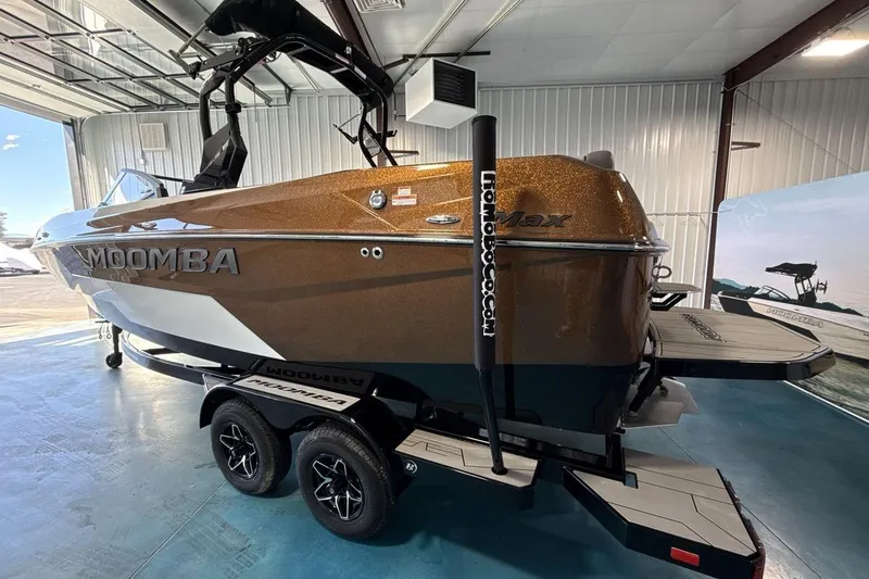 Slide: The Image of 2026 Moomba Max boat in showroom, featuring sleek design and metallic finish. - 3