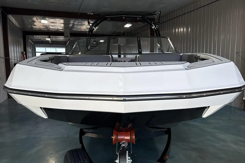 Slide: The Image of 2026 Moomba Max boat in a garage, showcasing sleek design and modern features. - 8