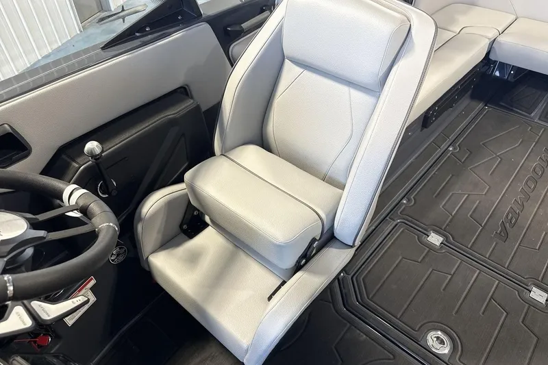 Slide: The Image of 2026 Moomba Tykon interior with sleek gray seating and modern steering wheel design. - 13