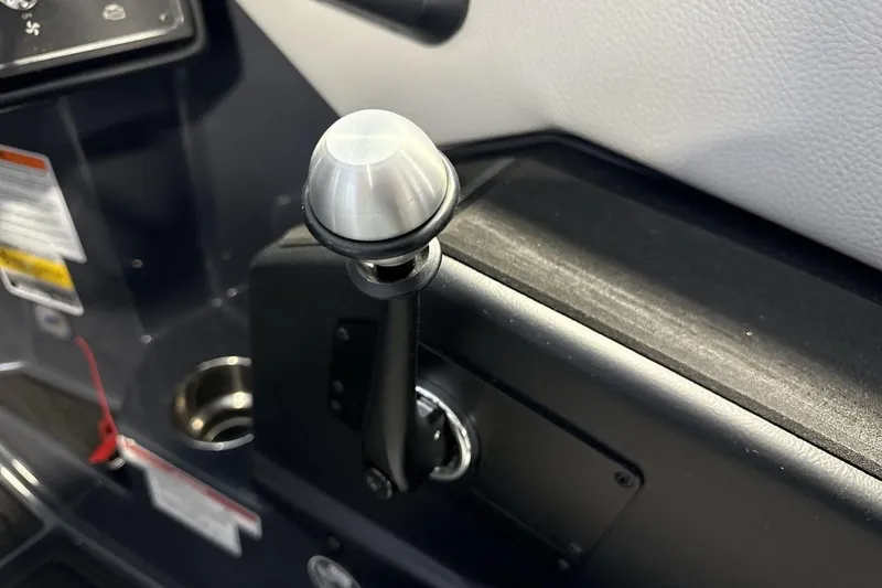 Slide: The Image of 2026 Moomba Tykon boat throttle control lever in cockpit. - 16