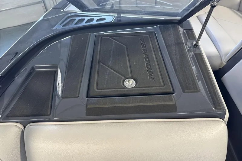 Slide: The Image of 2026 Moomba Tykon boat interior with sleek dashboard and storage compartment. - 18