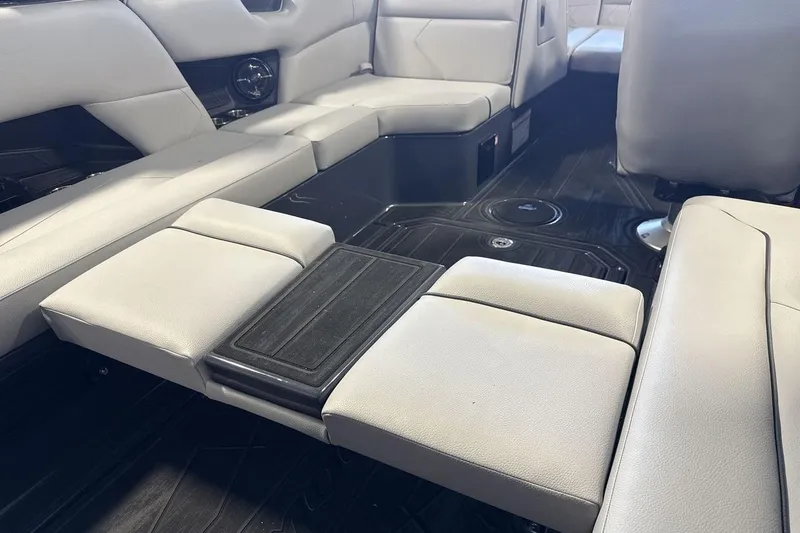 Slide: The Image of 2026 Moomba Tykon boat interior with sleek, modern seating and integrated storage. - 21