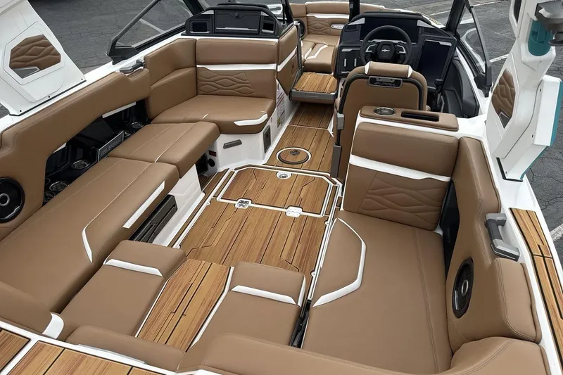Slide: The Image of Luxurious interior of 2026 Supra SV boat with tan leather seating and wood accents. - 10