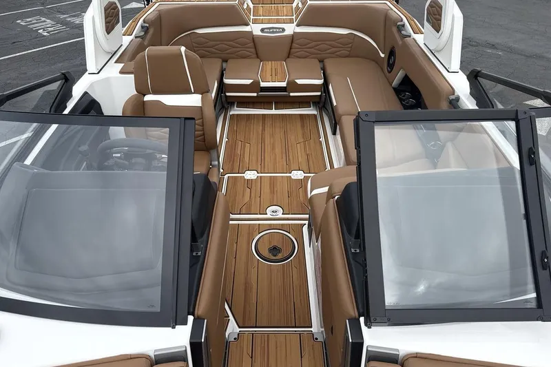 Slide: The Image of 2026 Supra SV boat interior with luxurious brown seating and sleek design. - 12
