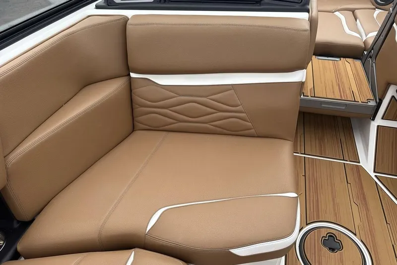 Slide: The Image of Luxurious tan leather seating in 2026 Supra SV boat interior, featuring elegant stitching and wood accents. - 17