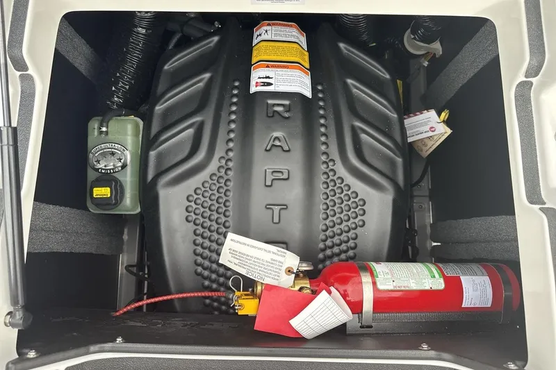 Slide: The Image of Engine compartment of a 2026 Supra SV with safety equipment and emission label. - 20