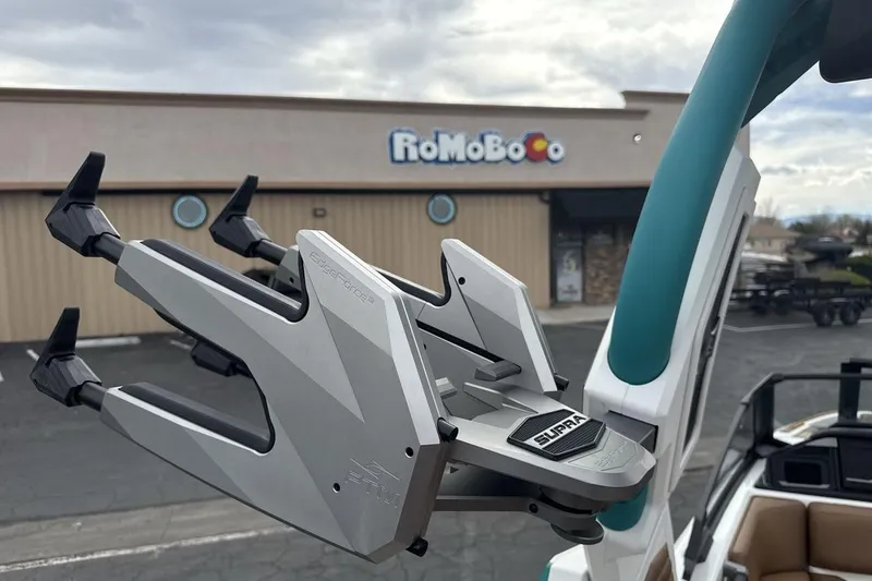 Slide: The Image of 2026 Supra SV boat accessory in parking lot, with building in background. - 22