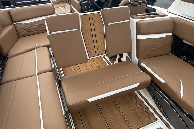 Slide: The Image of Luxurious 2026 Supra SV boat interior with brown leather seating and wood accents. - 24