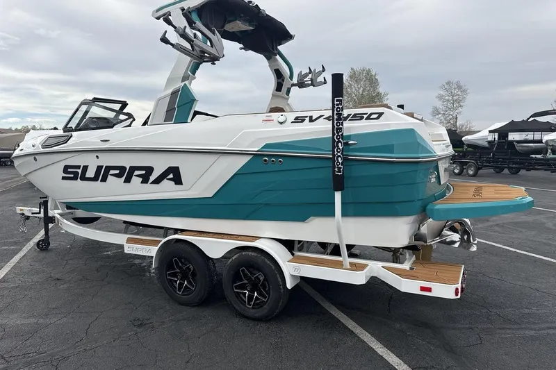 Slide: The Image of 2026 Supra SV boat on trailer, featuring sleek design and vibrant teal accents. - 3