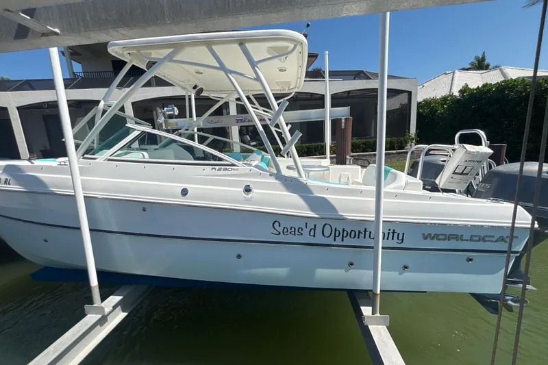 Slide: The Image of 2018 World Cat 230 SD boat named "Sea's'd Opportunity" docked in marina. - 4