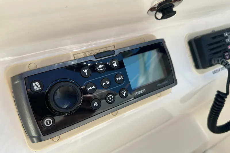 Slide: The Image of Fusion marine stereo system on a 1998 Sea Ray 215 Express Cruiser dashboard. - 29