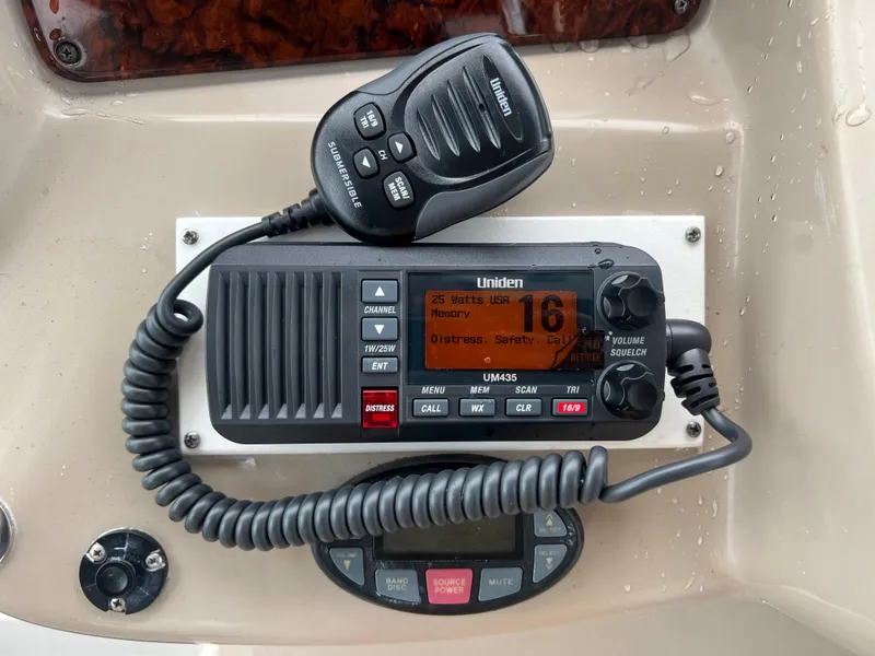 Slide: The Image of VHF marine radio on 2005 Sea Ray 340 Sundancer boat dashboard. - 16