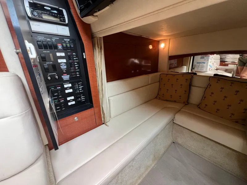 Slide: The Image of Interior of 2005 Sea Ray 340 Sundancer with beige seating and control panel. - 23