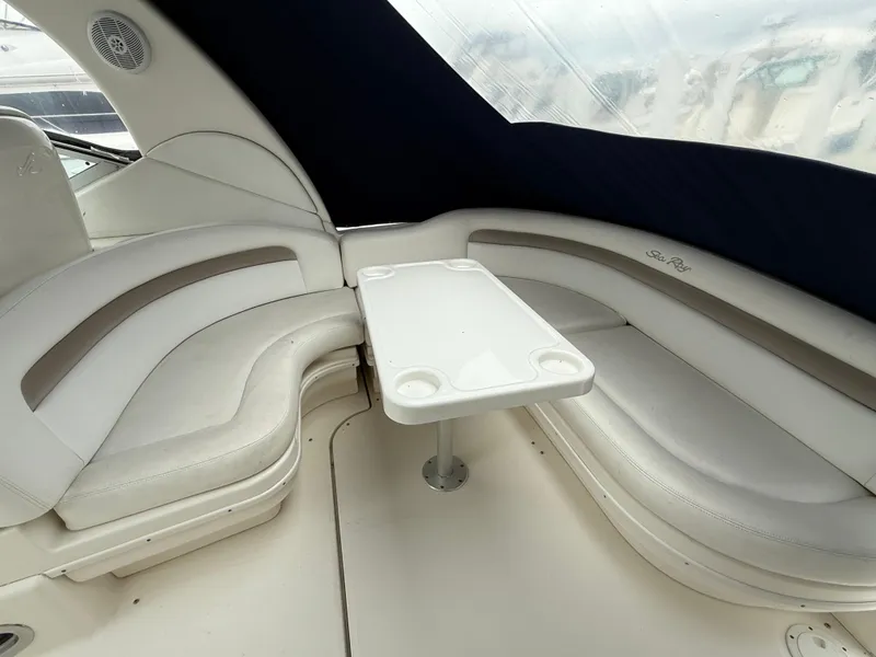 Slide: The Image of 2005 Sea Ray 340 Sundancer interior with white seating and table. - 34