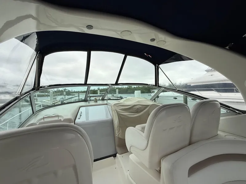 Slide: The Image of Interior view of 2005 Sea Ray 340 Sundancer yacht with covered seating and helm. - 35