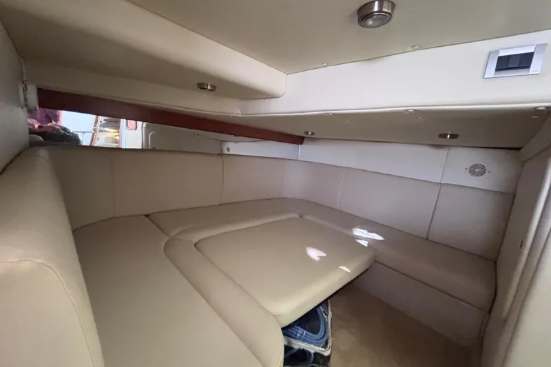 Slide: The Image of Interior cabin of 2007 Rinker EX 370 boat with beige seating and modern design. - 17