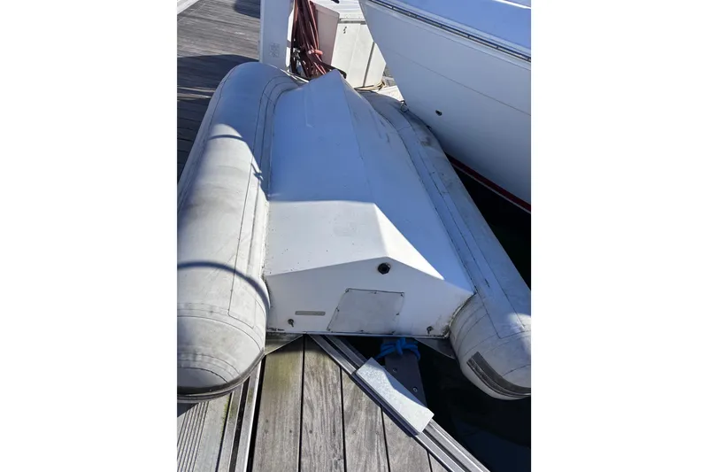 Slide: The Image of Inflatable dinghy docked beside a 2007 Rinker EX 370 boat. - 20