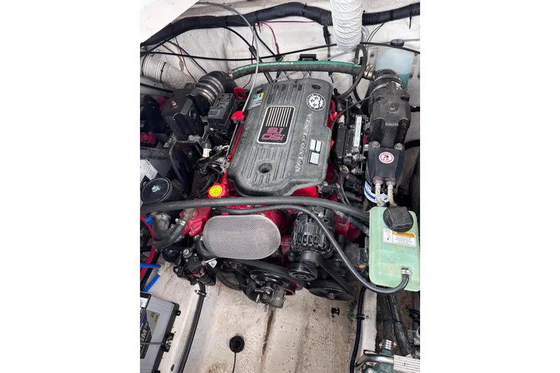 Slide: The Image of Engine compartment of a 2007 Rinker EX 370 boat, featuring a powerful motor. - 23