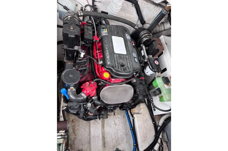 Slide: The Image of Engine compartment of a 2007 Rinker EX 370 boat, featuring a Volvo Penta engine. - 24