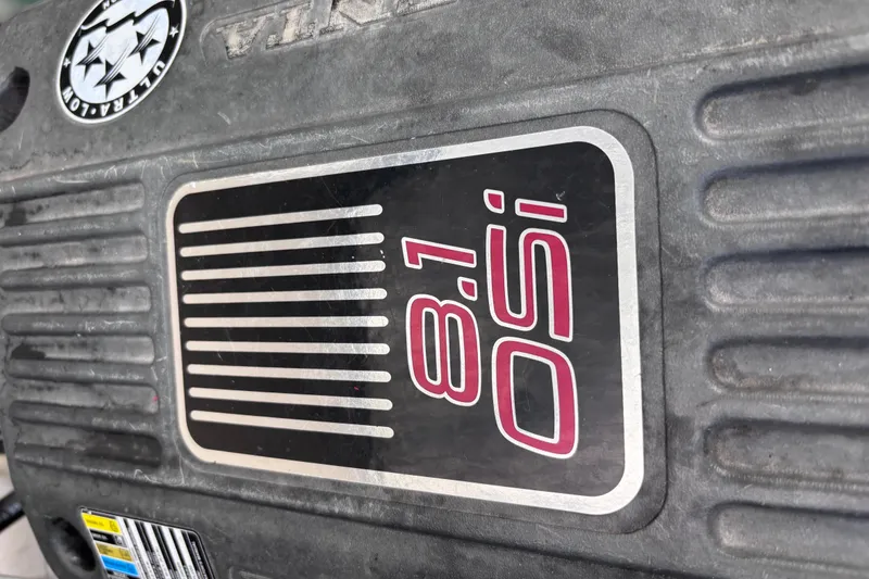 Slide: The Image of Engine cover of a 2007 Rinker EX 370 with 8.1 SSi branding. - 25