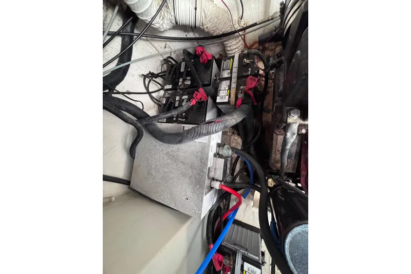 Slide: The Image of Engine compartment of a 2007 Rinker EX 370 boat showing battery and wiring. - 27